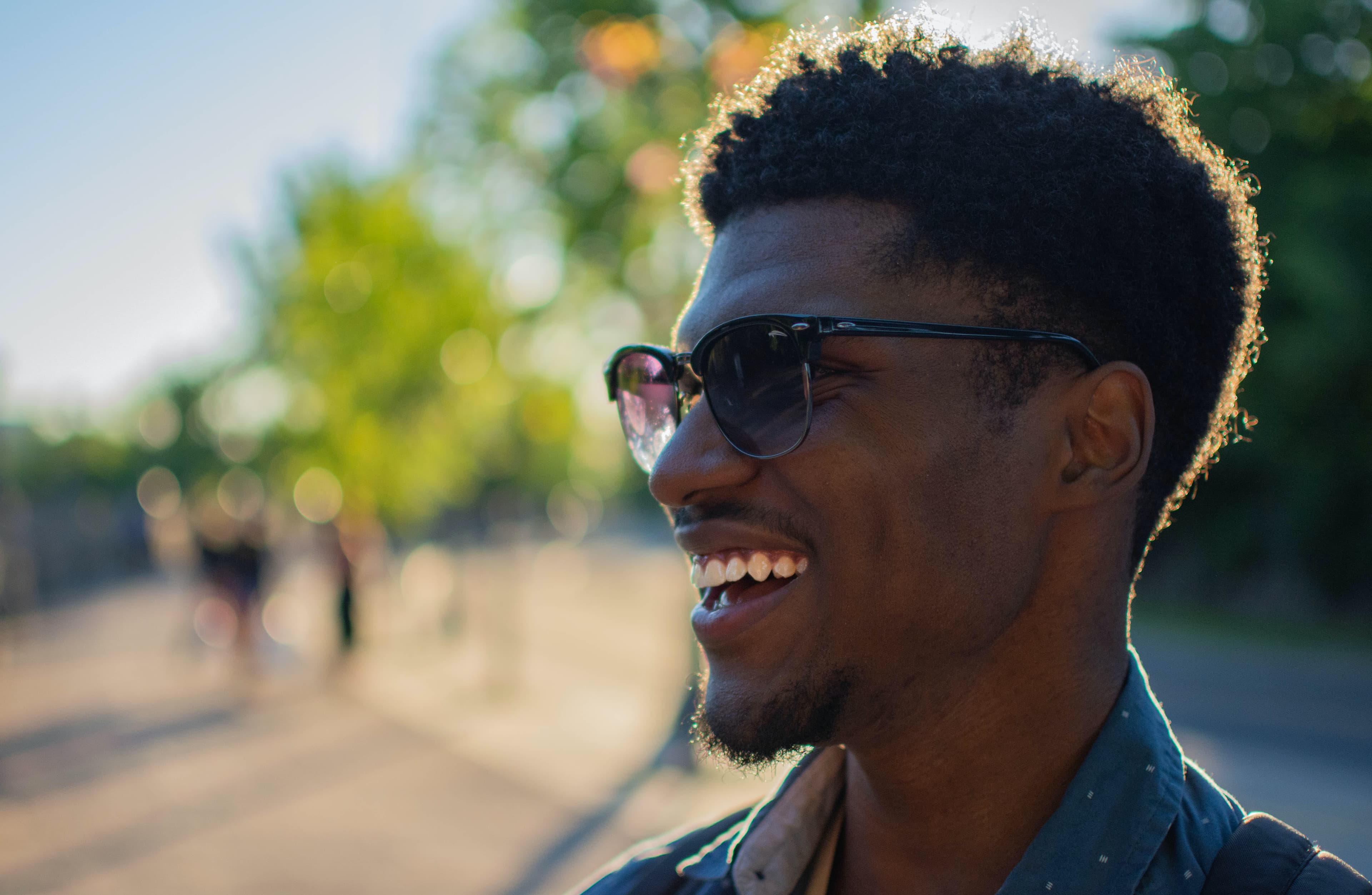 A man in sunglasses smiling